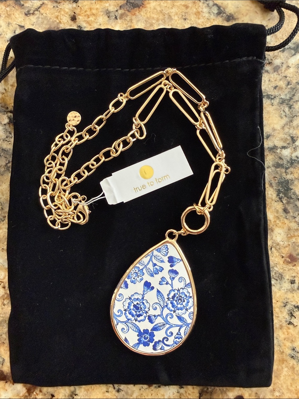 True to Form Gold Necklace with Blue and White Floral Teardrop Pendant
